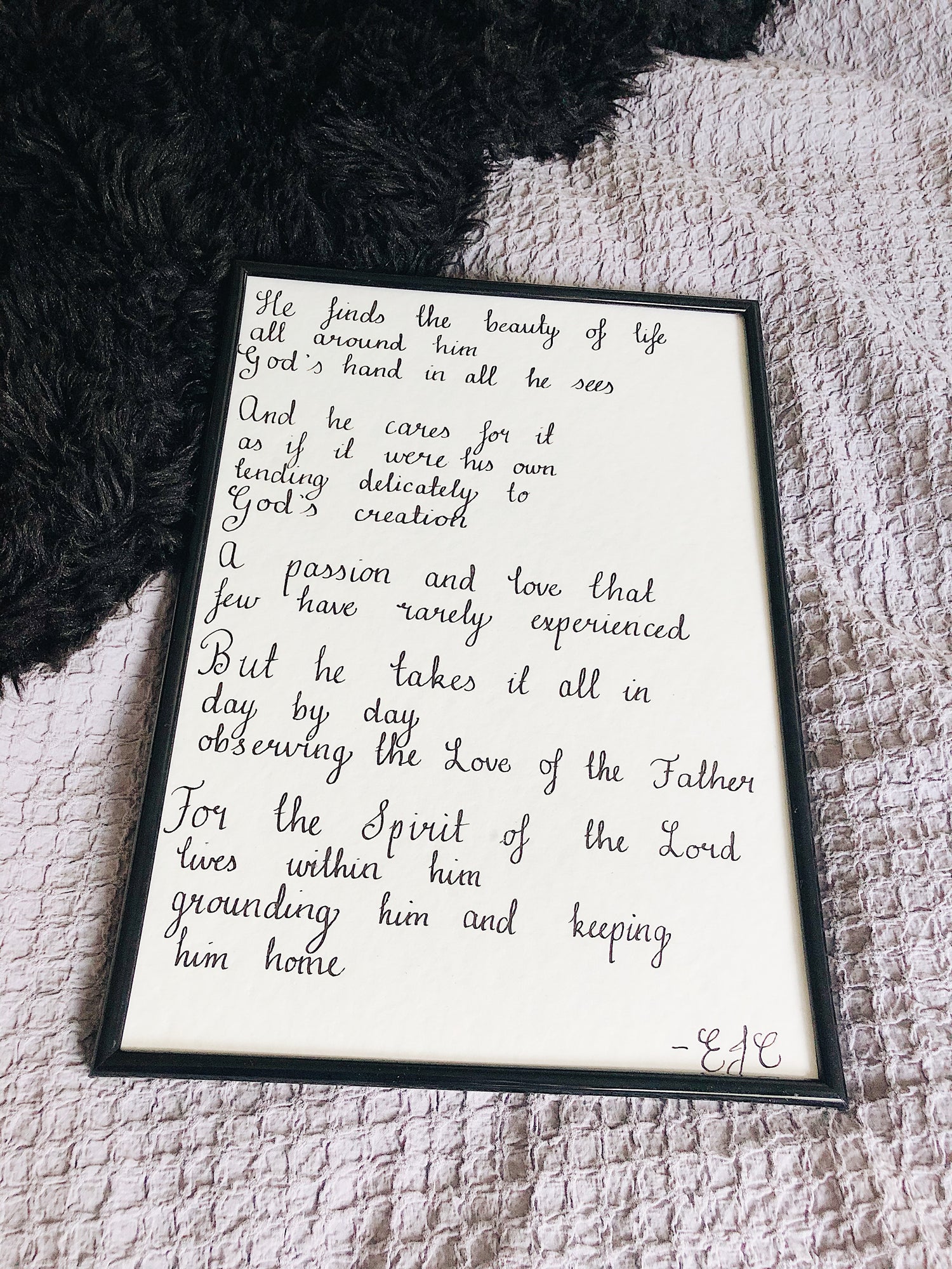 prophetic poem in frame, laying on bed